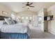 Main bedroom with vaulted ceilings and ensuite bathroom at 3475 Golden Spur Loop, Castle Rock, CO 80108