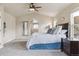 Inviting main bedroom boasts plush carpet, neutral walls, and adjoins the ensuite bathroom at 3475 Golden Spur Loop, Castle Rock, CO 80108