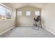 Sitting area with neutral walls, plush gray carpet, and sunny windows at 3475 Golden Spur Loop, Castle Rock, CO 80108