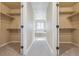 This walk-in closet provides ample space and leads to the bathroom at 3475 Golden Spur Loop, Castle Rock, CO 80108