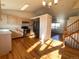 Kitchen with light wood cabinets, hardwood floors, and stainless steel appliances at 3802 Desert Willow Ave, Broomfield, CO 80020