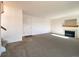 Spacious living room featuring a fireplace and carpet at 3802 Desert Willow Ave, Broomfield, CO 80020