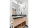 Modern bathroom vanity with light wood cabinets, stylish sink, and contemporary mirror at 603 Inca St # 530, Denver, CO 80204