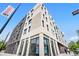 Modern multi-story apartment building featuring stylish brickwork and ample natural light from large windows at 603 Inca St # 530, Denver, CO 80204