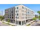Modern multi-story apartment building featuring stylish brickwork and ample natural light from large windows at 603 Inca St # 530, Denver, CO 80204