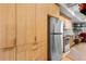 Bright kitchen with modern wood cabinets, stainless steel appliances, and ample storage at 603 Inca St # 530, Denver, CO 80204