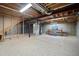 Unfinished basement with concrete walls and floor, exposed ceiling, and natural light from the window at 17235 Opal Hill Dr, Parker, CO 80134