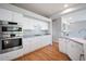 Well-lit kitchen with stainless steel appliances, including built-in oven and gas cooktop at 17235 Opal Hill Dr, Parker, CO 80134
