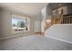 Spacious living room featuring a large window providing plenty of natural light and a view to the outdoors at 17235 Opal Hill Dr, Parker, CO 80134