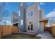 Backyard featuring a private deck, modern siding, and a well-maintained fence at 3930 Yates St, Denver, CO 80212