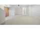 Expansive basement offering generous space, neutral carpeting, white walls, and potential for various recreational activities at 3930 Yates St, Denver, CO 80212