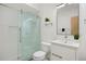 Sleek bathroom featuring a modern vanity, glass-enclosed shower, and contemporary fixtures for a luxurious experience at 3930 Yates St, Denver, CO 80212