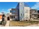 Modern home exterior featuring clean lines, mixed materials, large windows, and a well-manicured front yard at 3930 Yates St, Denver, CO 80212