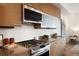 Modern kitchen with stylish appliances, granite countertops, and sleek cabinetry at 3930 Yates St, Denver, CO 80212