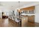 Open-concept kitchen with granite countertops, stainless steel appliances, and an island with barstool seating at 3930 Yates St, Denver, CO 80212