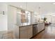 Gourmet kitchen island featuring granite countertops, stainless steel appliances, and open layout concept at 3930 Yates St, Denver, CO 80212