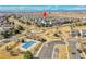 Aerial view of neighborhood including community pool, park, and playground at 10622 Racine St, Commerce City, CO 80022