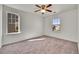 Bedroom featuring ample natural light and neutral carpet at 10622 Racine St, Commerce City, CO 80022