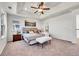 Spacious main bedroom suite features a trey ceiling, ceiling fan, and plenty of natural light at 10622 Racine St, Commerce City, CO 80022