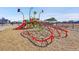 Community playground features colorful play structures and climbing nets at 10622 Racine St, Commerce City, CO 80022