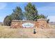 Community entrance featuring a stone sign with the Turnberry community name and landscaping at 10622 Racine St, Commerce City, CO 80022