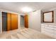 Bedroom features hardwood floors, a closet, and neutral paint at 1302 S Cape Way, Lakewood, CO 80232