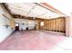 Spacious two-car garage with ample space for vehicles, storage, and a workbench at 1302 S Cape Way, Lakewood, CO 80232