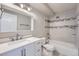 Modern bathroom featuring a sleek vanity, tiled shower, and contemporary fixtures at 3184 S Heather Gardens Way # 302, Aurora, CO 80014