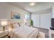 Cozy bedroom with a large bed and sliding door closet at 3184 S Heather Gardens Way # 302, Aurora, CO 80014