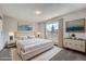 Bright bedroom with elegant decor, large window, and stylish furnishings at 3184 S Heather Gardens Way # 302, Aurora, CO 80014