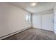 Cozy bedroom with a large closet, window, and soft carpet at 3184 S Heather Gardens Way # 302, Aurora, CO 80014