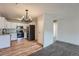 Modern kitchen featuring stainless steel appliances, granite countertops, and vinyl floors at 3184 S Heather Gardens Way # 302, Aurora, CO 80014