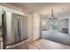 Open floor plan with view of the balcony from the kitchen and living room space at 3184 S Heather Gardens Way # 302, Aurora, CO 80014