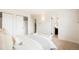 Serene bedroom featuring a cozy bed, minimalist decor, and closet with open doors at 129 Gordon Pl, Castle Rock, CO 80104