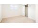 Bright, airy bedroom with a closet, carpet, and windows at 129 Gordon Pl, Castle Rock, CO 80104