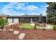 Charming single-story home featuring a two-car garage and a manicured front yard with beautiful landscaping at 129 Gordon Pl, Castle Rock, CO 80104