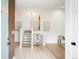 Open foyer area featuring a staircase, light hardwood floors, and modern decor at 129 Gordon Pl, Castle Rock, CO 80104