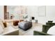 Bright living room features neutral colors, plush seating, and white staircase at 129 Gordon Pl, Castle Rock, CO 80104