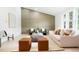 Bright living room boasts ample natural light, stylish furniture, and a neutral color palette at 129 Gordon Pl, Castle Rock, CO 80104