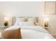 Serene main bedroom with a plush bed, stylish lamps, and neutral decor at 129 Gordon Pl, Castle Rock, CO 80104