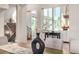 Elegant dining area featuring modern decor, wood floors, and bright natural light at 15501 Fairway Dr, Commerce City, CO 80022