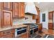 Well-equipped kitchen with stainless steel appliances and custom cabinets with plenty of space at 15501 Fairway Dr, Commerce City, CO 80022