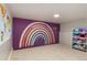 Playroom featuring a colorful rainbow mural with an organization system filled with toys at 15501 Fairway Dr, Commerce City, CO 80022