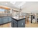 Modern kitchen with blue cabinets, stainless steel appliances, and an island at 5603 W 118Th Pl, Broomfield, CO 80020