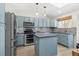 Updated kitchen featuring light blue cabinets and concrete countertops at 5603 W 118Th Pl, Broomfield, CO 80020