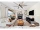 Living room with fireplace, large TV, and comfortable seating area at 5603 W 118Th Pl, Broomfield, CO 80020