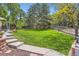 Lush backyard with a well maintained lawn and landscaping at 9743 Chanteclair Cir, Highlands Ranch, CO 80126