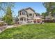 Large, beautiful backyard with patio, gazebo, and mature trees at 9743 Chanteclair Cir, Highlands Ranch, CO 80126