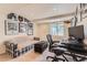Home office with a large desk and comfortable seating at 9743 Chanteclair Cir, Highlands Ranch, CO 80126