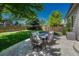 Inviting backyard patio with seating for outdoor enjoyment and a lush lawn at 21238 Snowshoe Ln, Parker, CO 80138